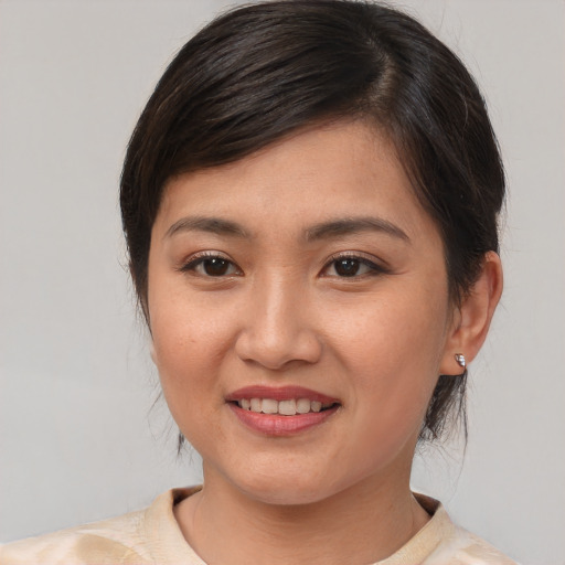 Joyful white young-adult female with medium  brown hair and brown eyes