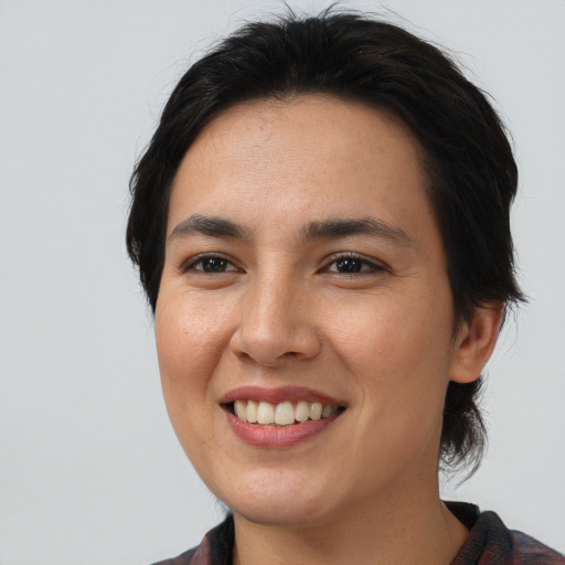Joyful asian young-adult female with medium  black hair and brown eyes
