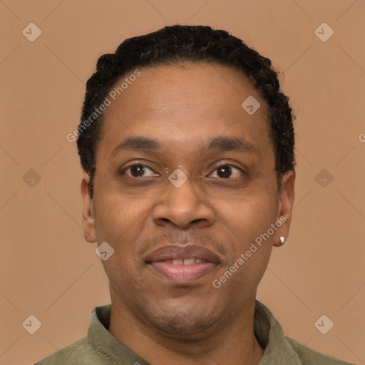 Joyful latino adult male with short  black hair and brown eyes