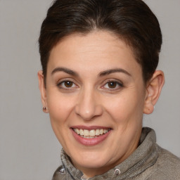 Joyful white adult female with short  brown hair and brown eyes