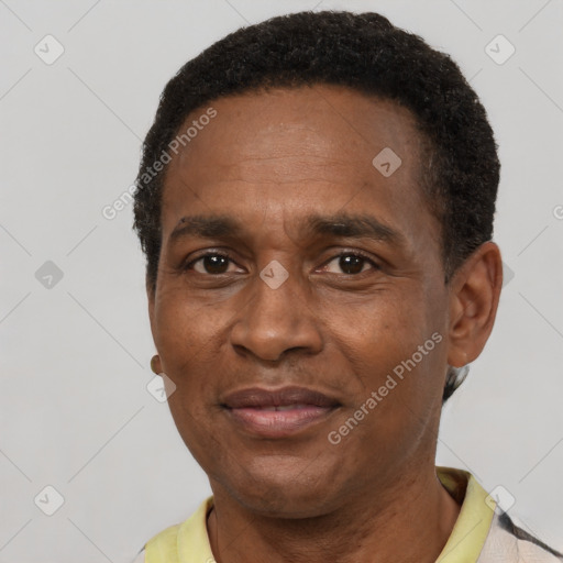 Joyful latino adult male with short  brown hair and brown eyes