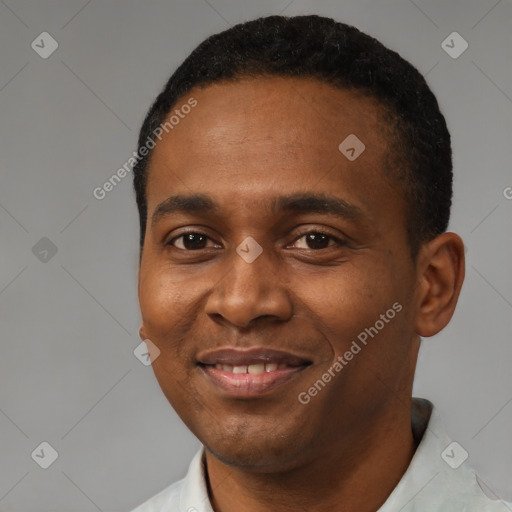 Joyful black young-adult male with short  black hair and brown eyes