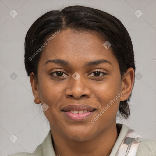 Joyful black young-adult female with short  brown hair and brown eyes