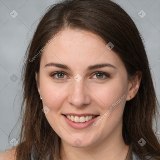 Joyful white young-adult female with long  brown hair and grey eyes