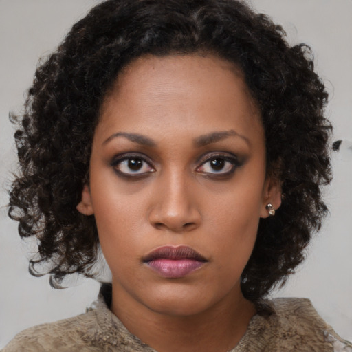 Neutral black young-adult female with medium  brown hair and brown eyes