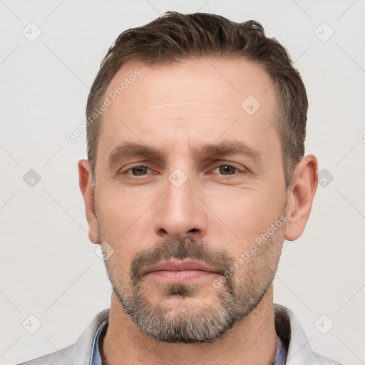 Neutral white adult male with short  brown hair and brown eyes