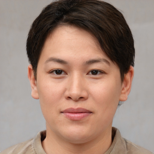Joyful white young-adult female with short  brown hair and brown eyes