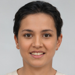 Joyful white young-adult female with short  brown hair and brown eyes