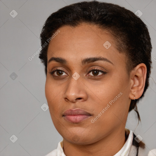 Joyful latino young-adult female with short  brown hair and brown eyes