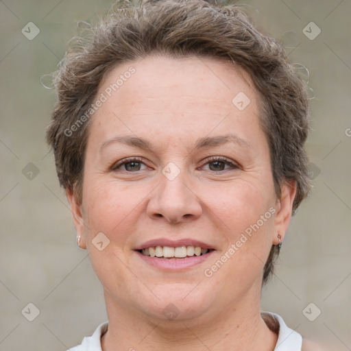 Joyful white adult female with short  brown hair and brown eyes