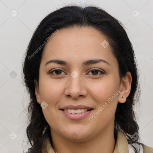 Joyful latino young-adult female with medium  brown hair and brown eyes