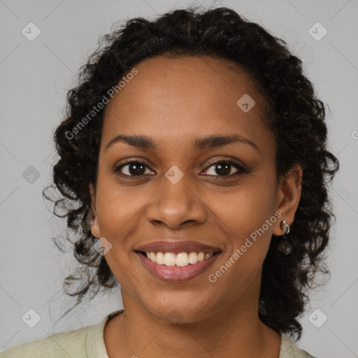 Joyful black young-adult female with medium  brown hair and brown eyes