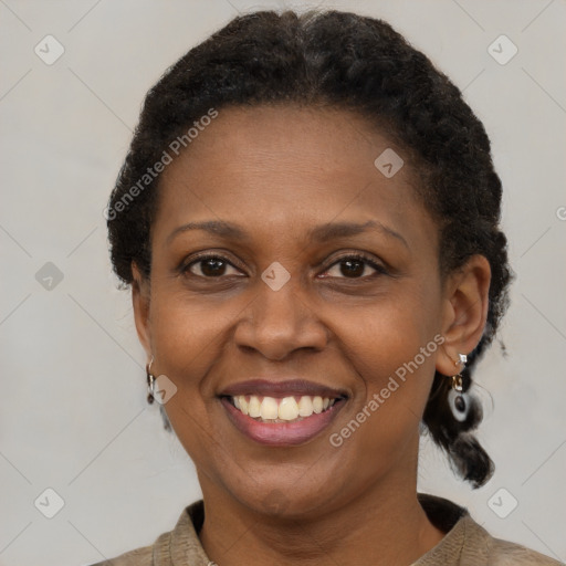 Joyful black adult female with short  brown hair and brown eyes