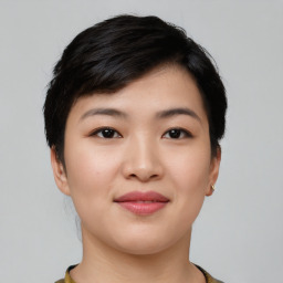 Joyful asian young-adult female with short  black hair and brown eyes