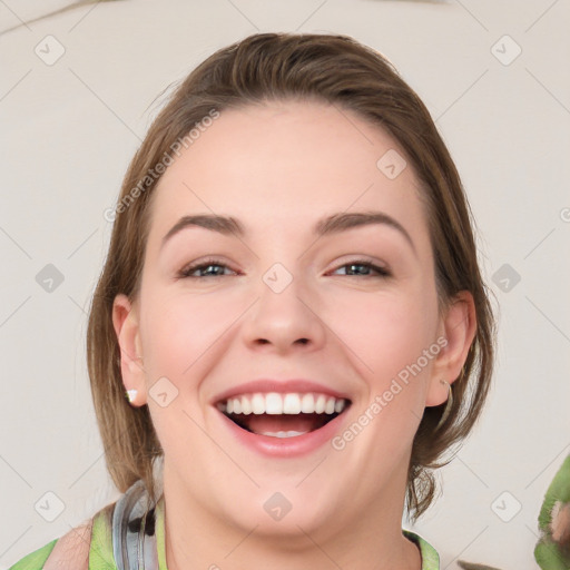 Joyful white young-adult female with medium  brown hair and green eyes