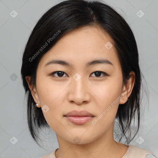 Joyful asian young-adult female with medium  black hair and brown eyes