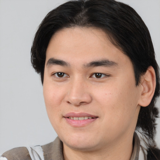 Joyful white young-adult male with medium  brown hair and brown eyes