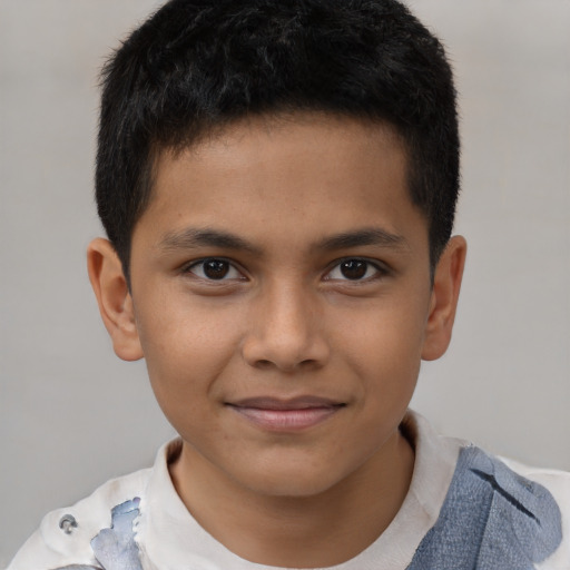Joyful black child male with short  brown hair and brown eyes