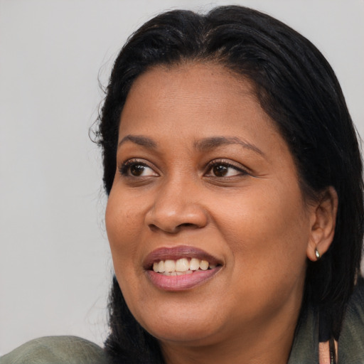Joyful asian adult female with medium  black hair and brown eyes