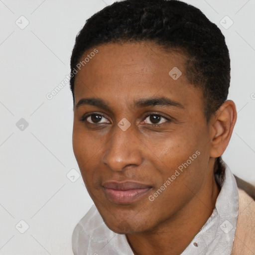 Joyful black young-adult male with short  black hair and brown eyes