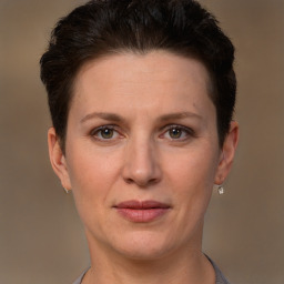 Joyful white adult female with short  brown hair and brown eyes