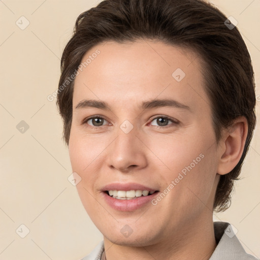 Joyful white young-adult female with short  brown hair and brown eyes