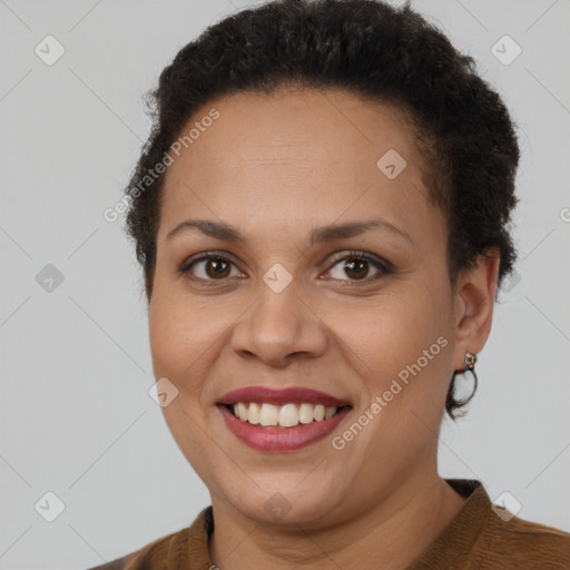 Joyful latino young-adult female with short  brown hair and brown eyes