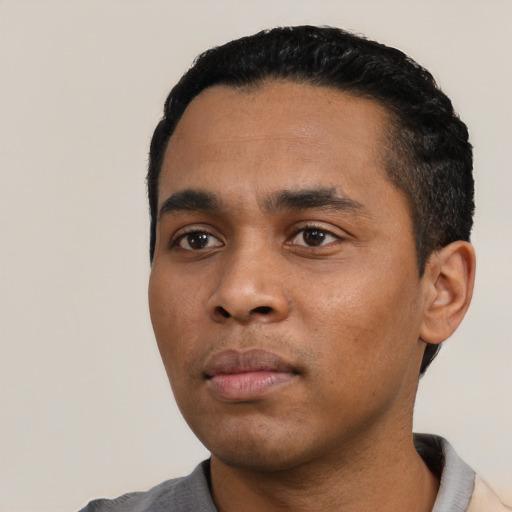 Neutral black young-adult male with short  black hair and brown eyes