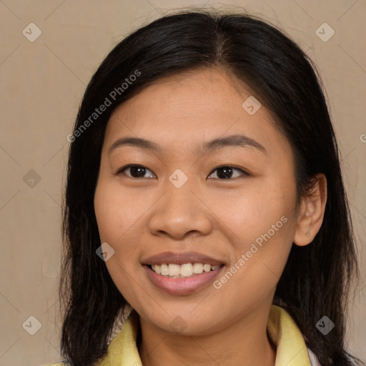 Joyful latino young-adult female with long  brown hair and brown eyes