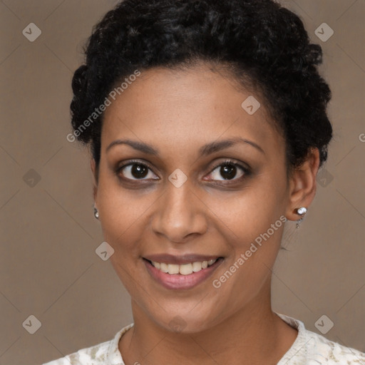 Joyful black young-adult female with short  brown hair and brown eyes