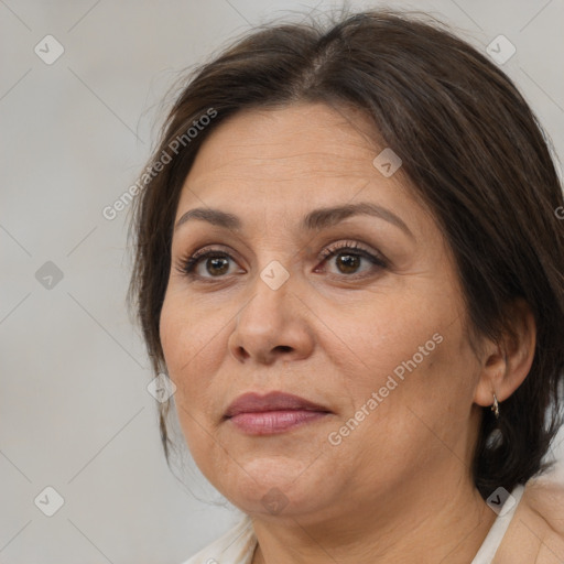 Joyful white adult female with medium  brown hair and brown eyes