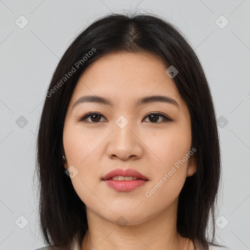 Joyful asian young-adult female with long  brown hair and brown eyes