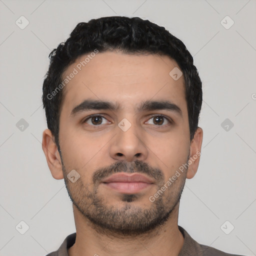 Neutral latino young-adult male with short  black hair and brown eyes