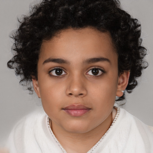 Joyful latino child female with medium  brown hair and brown eyes