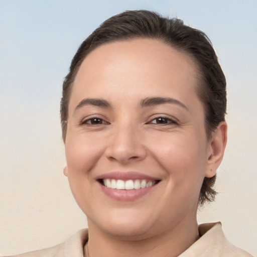 Joyful white young-adult female with medium  brown hair and brown eyes