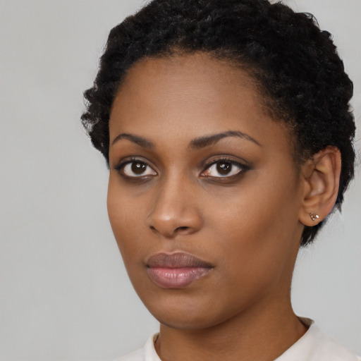 Neutral black young-adult female with short  black hair and brown eyes