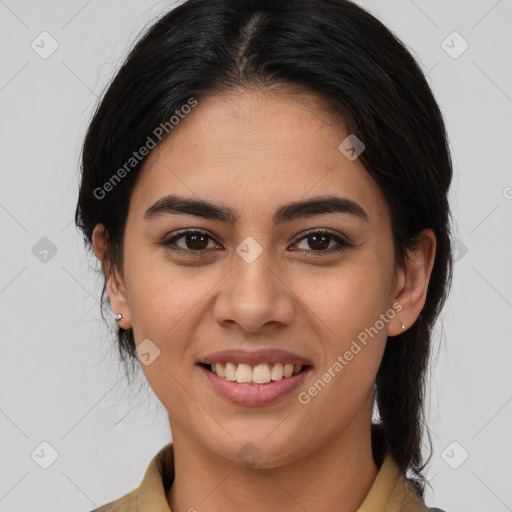 Joyful latino young-adult female with medium  brown hair and brown eyes