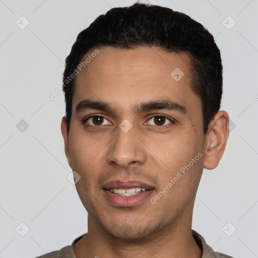 Joyful white young-adult male with short  black hair and brown eyes