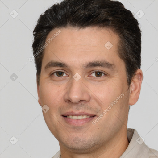 Joyful white adult male with short  brown hair and brown eyes