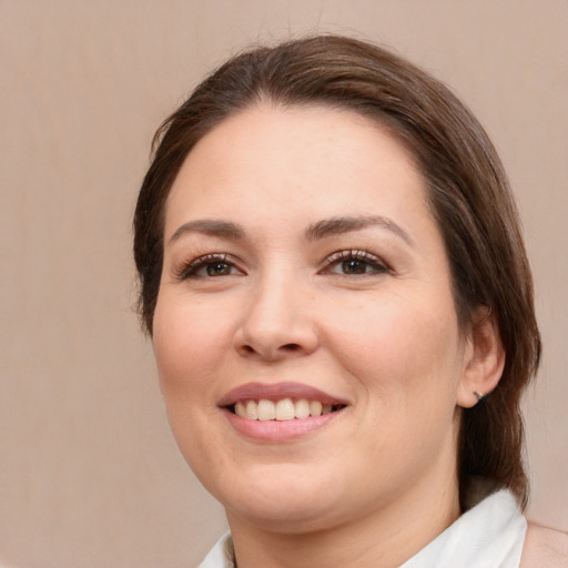 Joyful white young-adult female with medium  brown hair and brown eyes