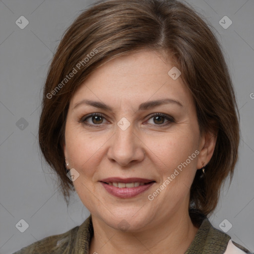 Joyful white adult female with medium  brown hair and brown eyes