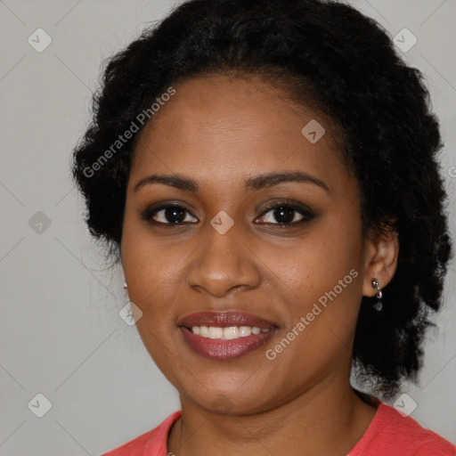 Joyful black young-adult female with long  brown hair and brown eyes