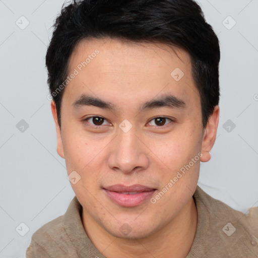 Joyful asian young-adult male with short  brown hair and brown eyes