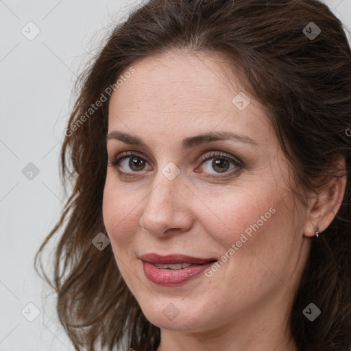 Joyful white adult female with medium  brown hair and grey eyes