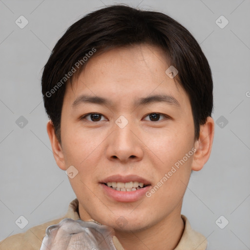 Joyful asian young-adult male with short  brown hair and brown eyes