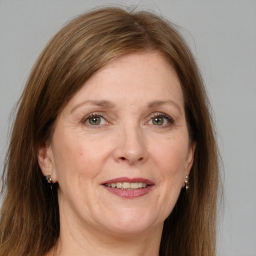 Joyful white adult female with medium  brown hair and grey eyes