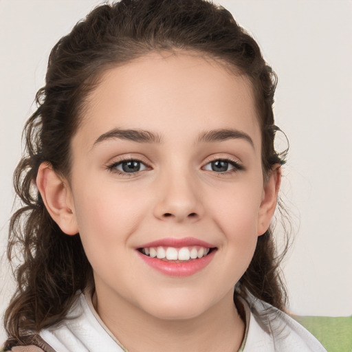 Joyful white child female with medium  brown hair and brown eyes