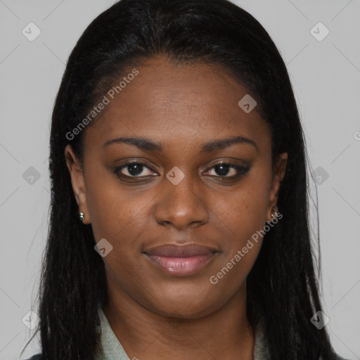 Joyful black young-adult female with long  brown hair and brown eyes