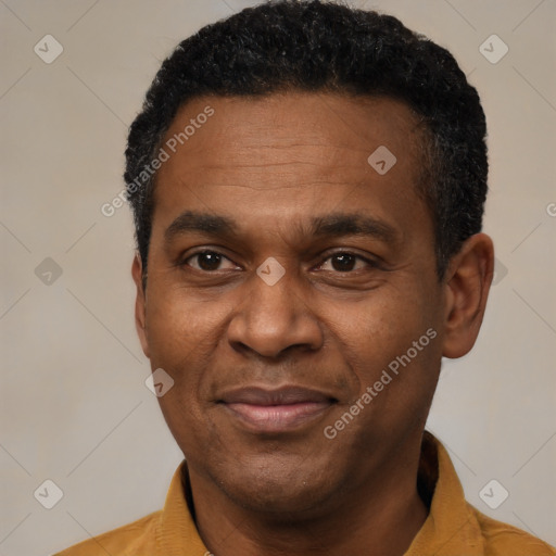 Joyful black adult male with short  black hair and brown eyes
