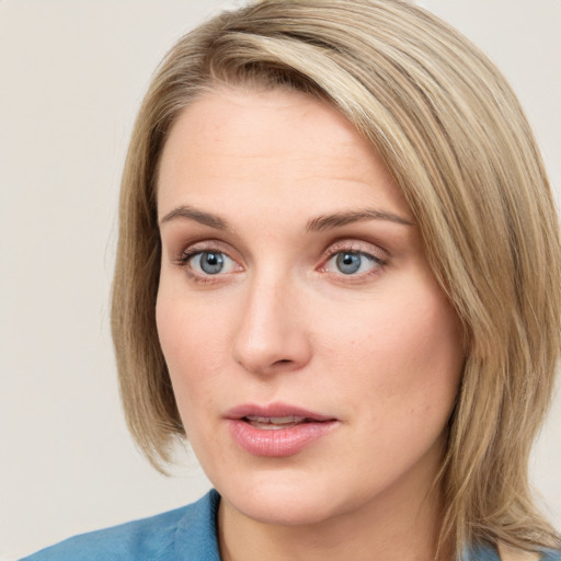 Neutral white young-adult female with medium  brown hair and blue eyes